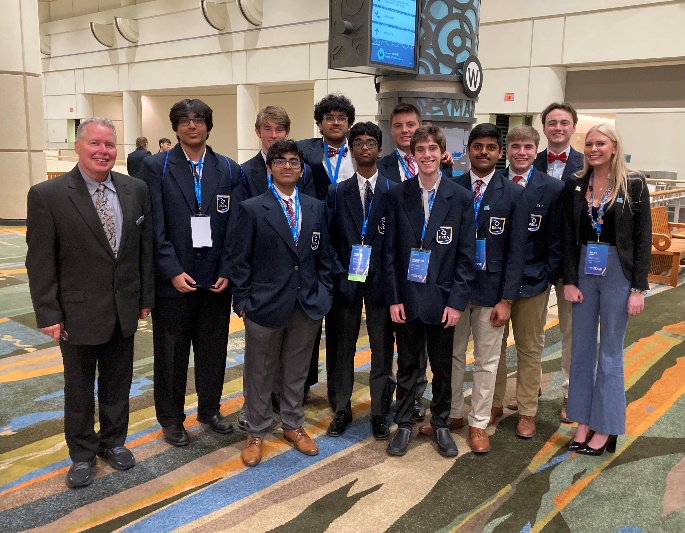 Students standing with Mr. Hicks at DECA.